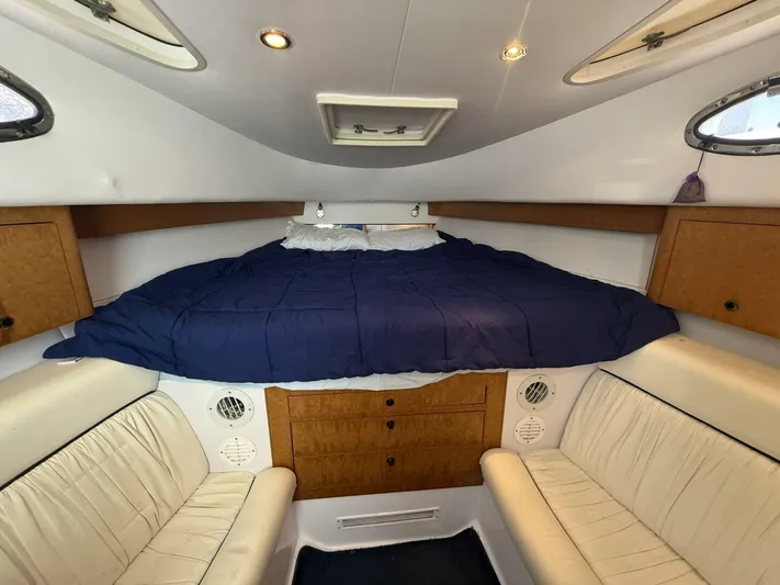  Yacht Photos Pics Interior cabin of 2007 Donzi 38 ZSF boat with bed and seating area.