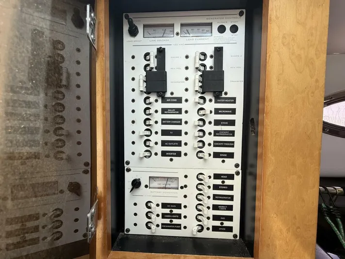  Yacht Photos Pics Electrical control panel inside a 2007 Donzi 38 ZSF boat, featuring labeled switches and gauges.