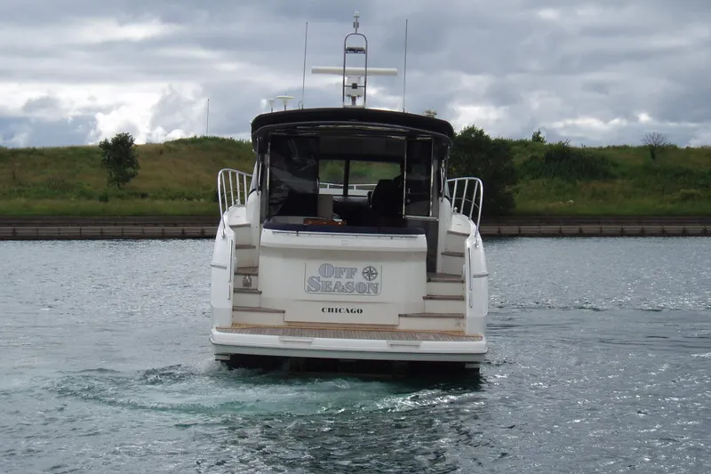 Off Season Yacht Photos Pics 2015 Princess V48 yacht named "Off Season" on a calm waterway.