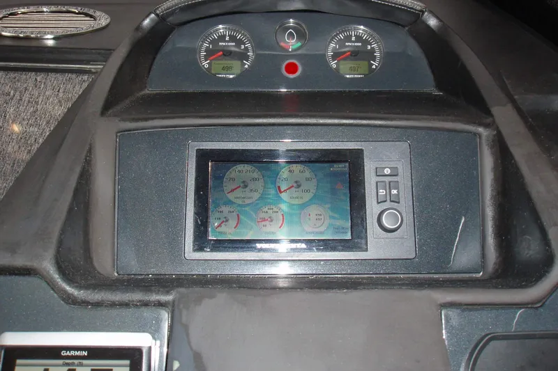 Off Season Yacht Photos Pics Dashboard of a 2015 Princess V48 yacht with digital and analog gauges.