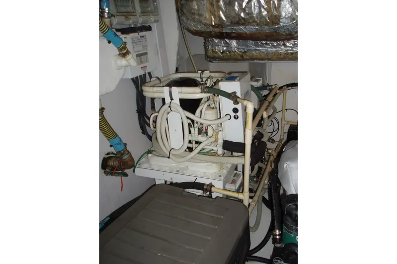 Off Season Yacht Photos Pics Engine room of 2015 Princess V48 yacht with complex piping and machinery.