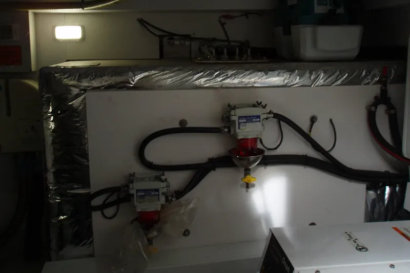 Off Season Yacht Photos Pics Engine room of a 2015 Princess V48 yacht with mechanical components and wiring.