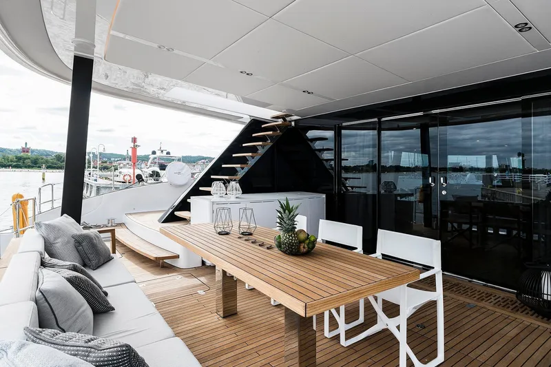  Yacht Photos Pics Luxurious Sunreef 80 yacht deck with elegant seating and dining area, 2026 model.