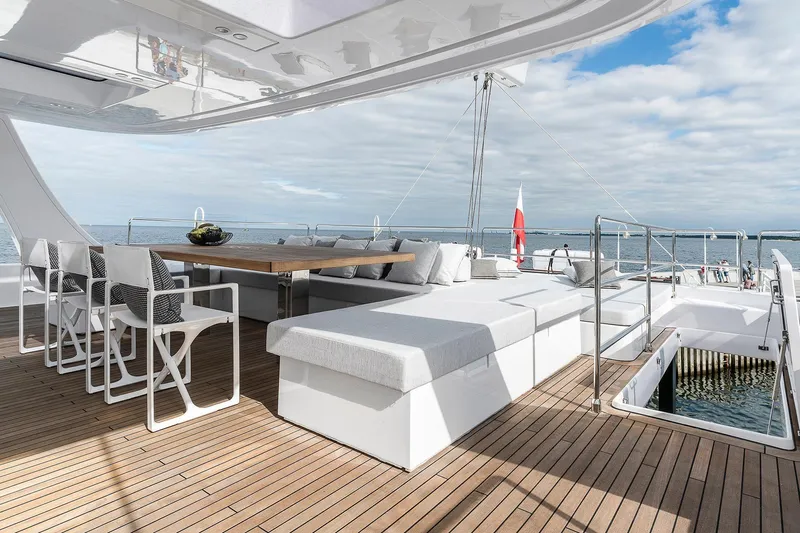  Yacht Photos Pics Luxurious Sunreef 80 yacht deck with elegant seating and ocean view, 2026 model.