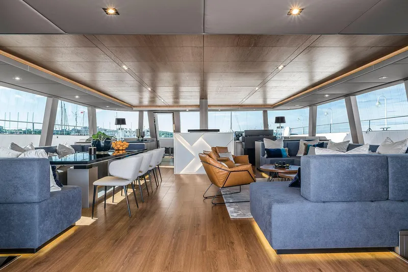  Yacht Photos Pics Luxurious interior of 2026 Sunreef 80 yacht with modern furnishings and panoramic windows.