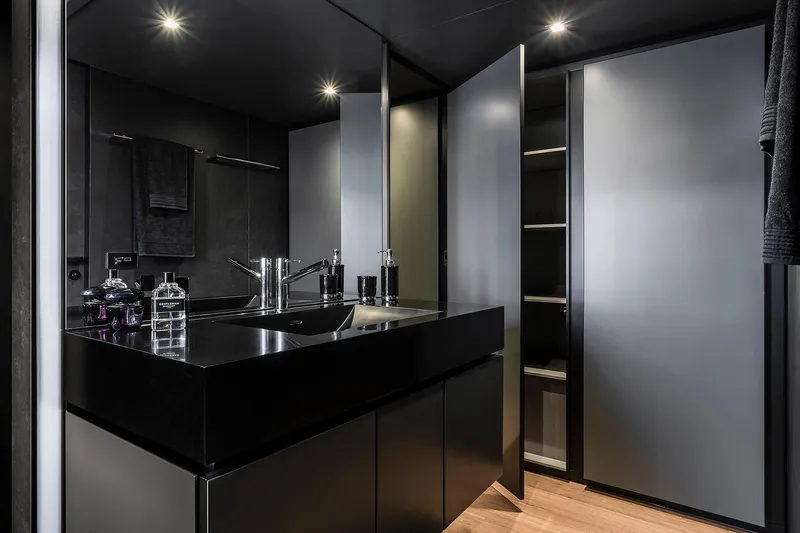  Yacht Photos Pics Luxurious bathroom interior on 2026 Sunreef 80 yacht, featuring sleek black fixtures and modern design.
