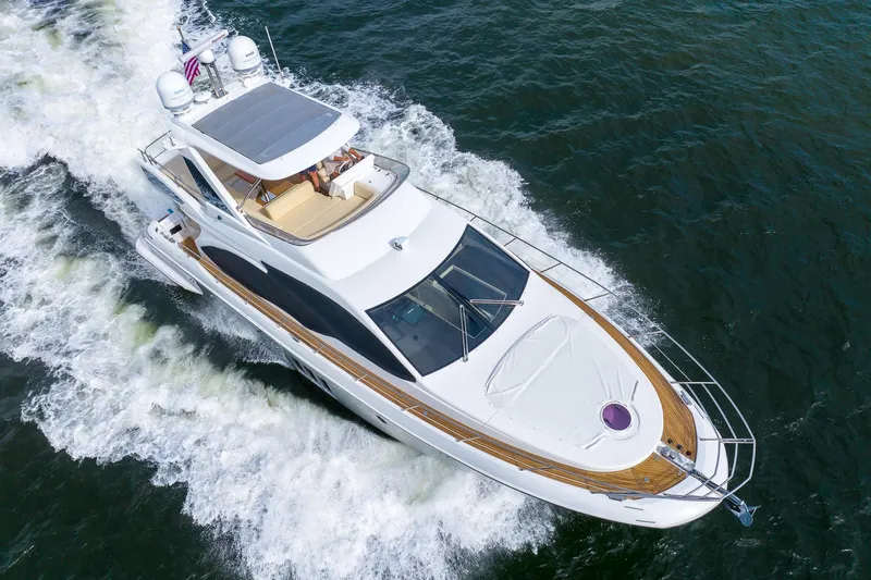 “just Chillin” Yacht Photos Pics 2014 Azimut 54 Flybridge yacht cruising on open water, aerial view.