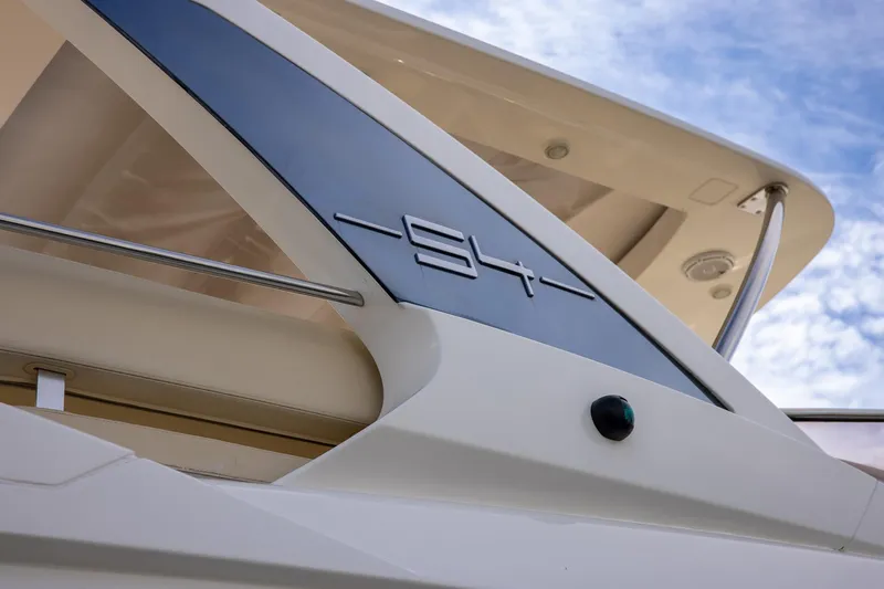 “just Chillin” Yacht Photos Pics 2014 Azimut 54 Flybridge yacht detail with sleek design against blue sky.