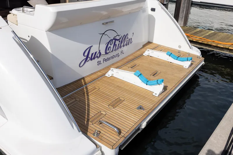 “just Chillin” Yacht Photos Pics 2014 Azimut 54 Flybridge yacht stern with wooden deck, docked in St. Petersburg, FL.
