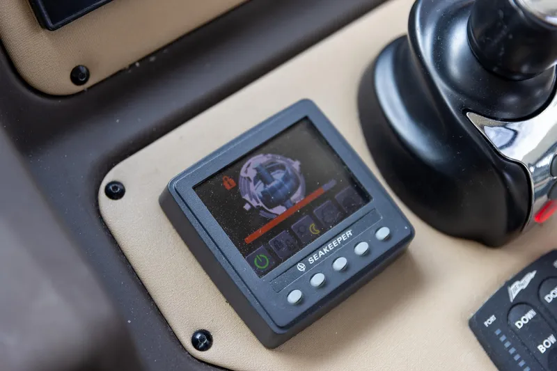 “just Chillin” Yacht Photos Pics Seakeeper control panel on 2014 Azimut 54 Flybridge yacht dashboard.