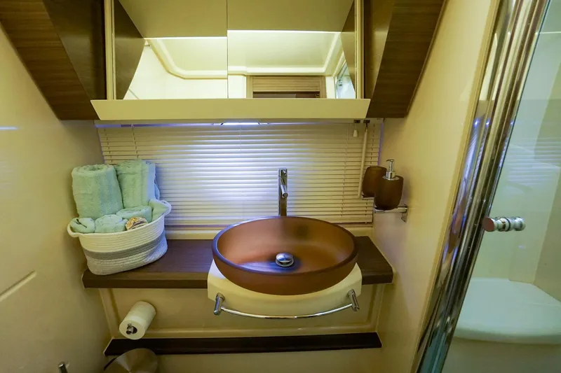 “just Chillin” Yacht Photos Pics Luxurious bathroom in 2014 Azimut 54 Flybridge yacht with modern sink and elegant decor.