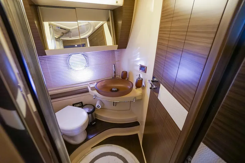 “just Chillin” Yacht Photos Pics Luxurious bathroom in 2014 Azimut 54 Flybridge yacht with modern fixtures and wood accents.