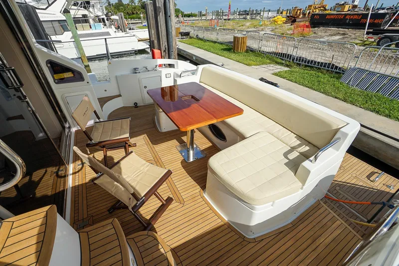 “just Chillin” Yacht Photos Pics Luxurious 2014 Azimut 54 Flybridge yacht deck with seating and table.