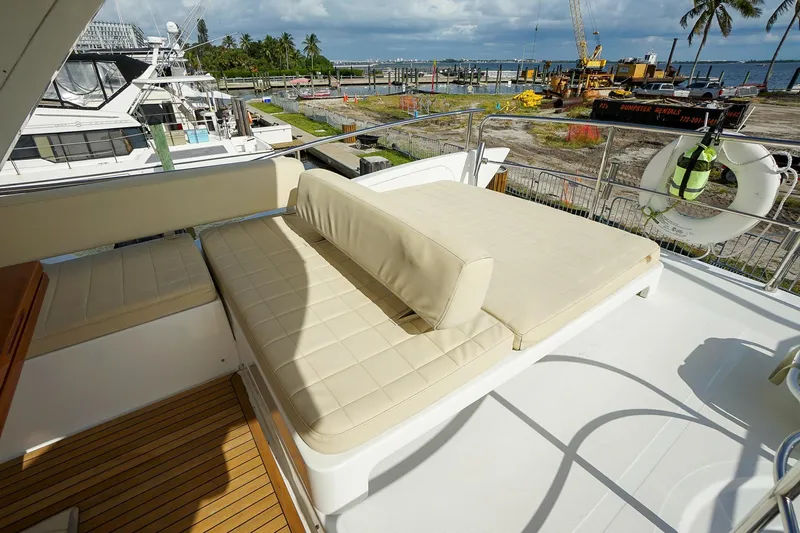“just Chillin” Yacht Photos Pics Luxurious seating area on 2014 Azimut 54 Flybridge yacht with scenic marina view.