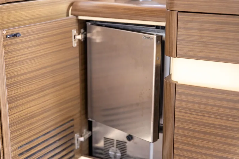 “just Chillin” Yacht Photos Pics 2014 Azimut 54 Flybridge yacht interior with open stainless steel fridge.