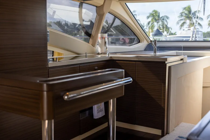 “just Chillin” Yacht Photos Pics Luxurious interior of 2014 Azimut 54 Flybridge yacht with modern kitchen and scenic view.