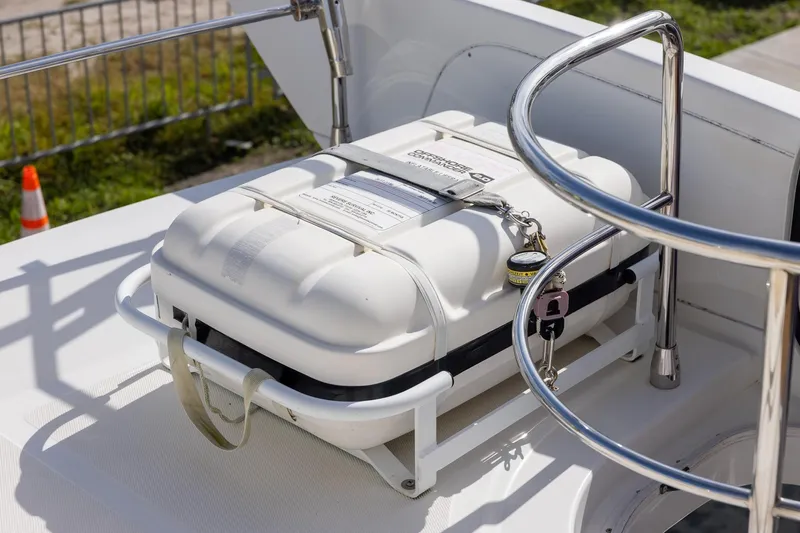 “just Chillin” Yacht Photos Pics Safety equipment on 2014 Azimut 54 Flybridge yacht deck, featuring a secured white container.