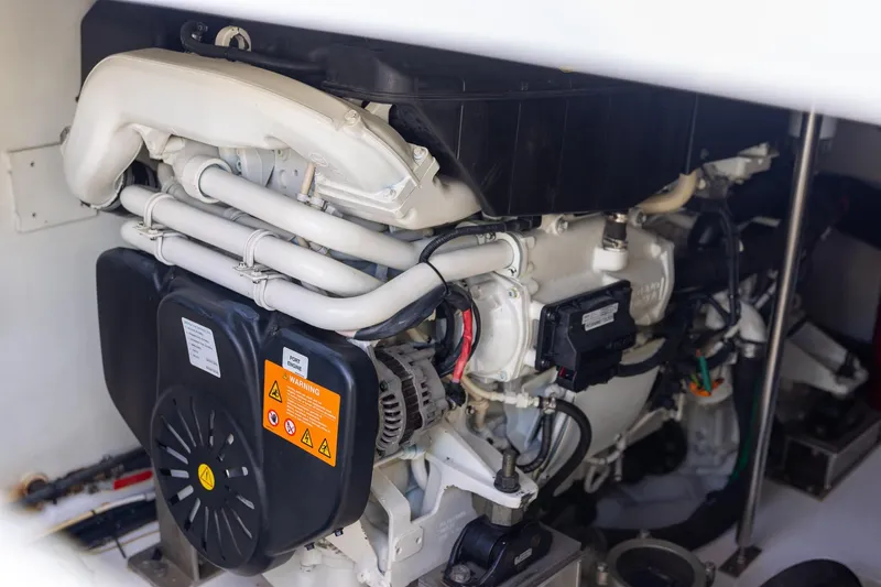 “just Chillin” Yacht Photos Pics Engine compartment of 2014 Azimut 54 Flybridge yacht, showcasing mechanical components.