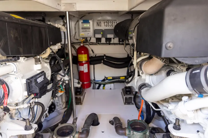 “just Chillin” Yacht Photos Pics Engine room of 2014 Azimut 54 Flybridge yacht, featuring dual engines and safety equipment.