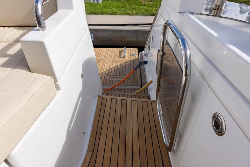 “just Chillin” Yacht Photos Pics 2014 Azimut 54 Flybridge yacht deck with teak flooring and stainless steel railing.