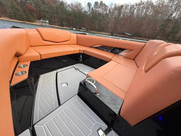  Yacht Photos Pics Luxurious seating area on 2022 Cruisers Yachts 338 CX SB, featuring tan upholstery and sleek design.