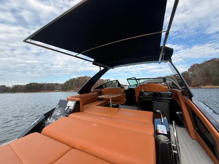  Yacht Photos Pics 2022 Cruisers Yachts 338 CX SB on water, featuring luxurious seating and canopy.