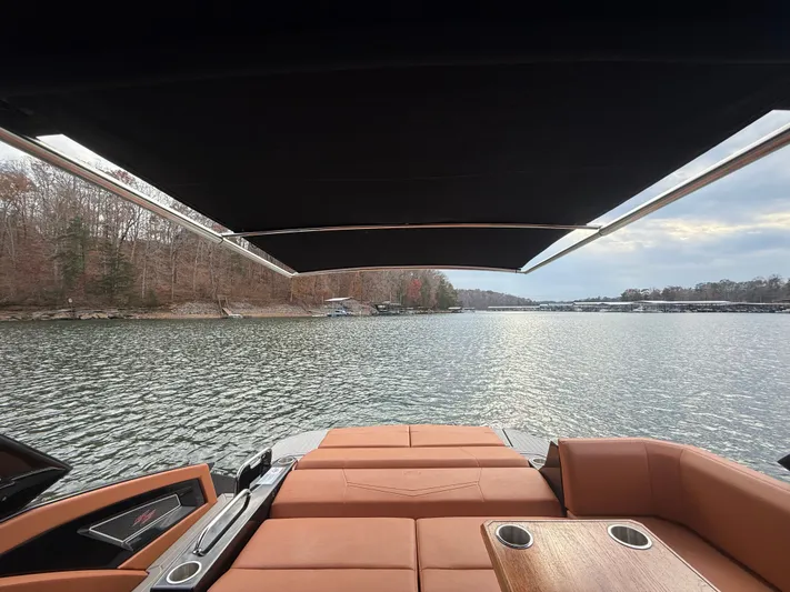  Yacht Photos Pics 2022 Cruisers Yachts 338 CX SB, luxurious seating, lake view, under canopy.