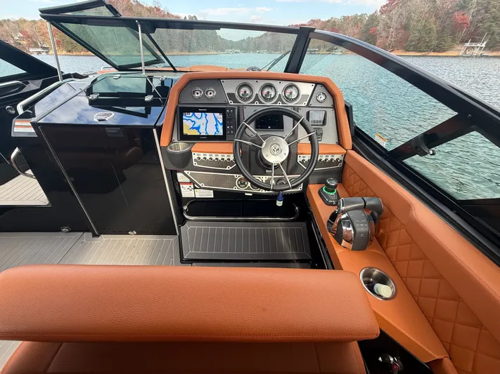  Yacht Photos Pics 2022 Cruisers Yachts 338 CX SB helm with modern controls and lake view.