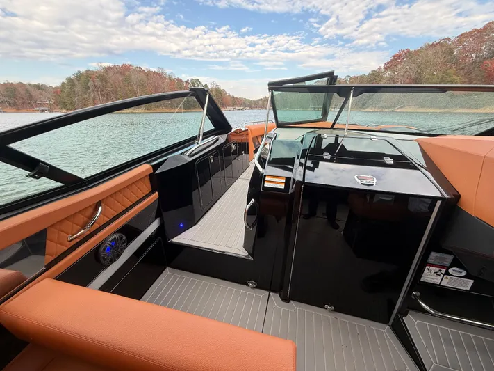  Yacht Photos Pics 2022 Cruisers Yachts 338 CX SB interior with luxurious seating and scenic lake view.