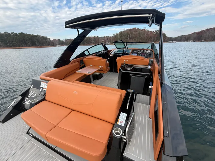  Yacht Photos Pics 2022 Cruisers Yachts 338 CX SB on a serene lake, featuring luxurious seating and modern design.