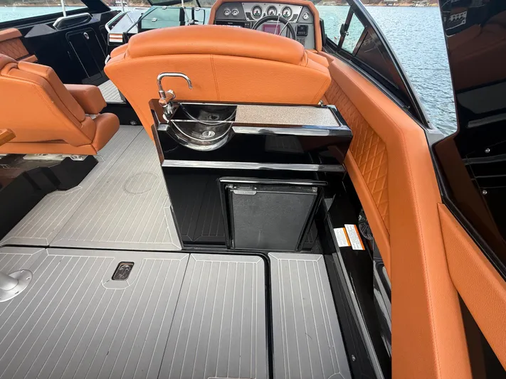  Yacht Photos Pics 2022 Cruisers Yachts 338 CX SB interior with orange seating and sleek design.