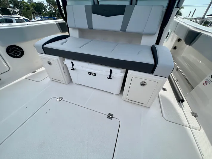  Yacht Photos Pics 2025 Robalo R300 boat interior with seating and Yeti cooler.