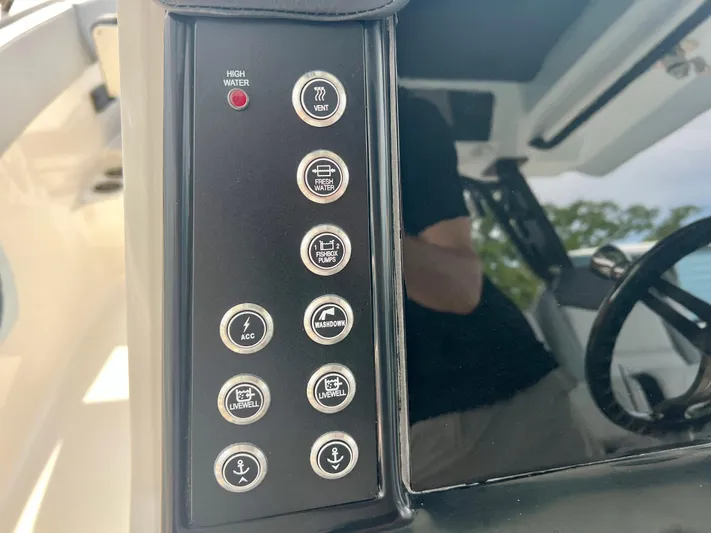  Yacht Photos Pics Control panel of 2025 Robalo R300 boat with various function buttons.