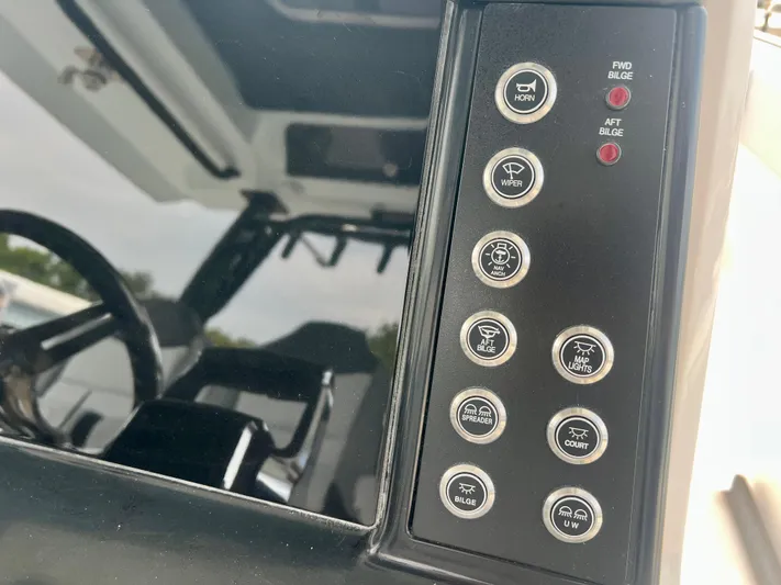  Yacht Photos Pics Control panel of 2025 Robalo R300 boat with various function buttons.