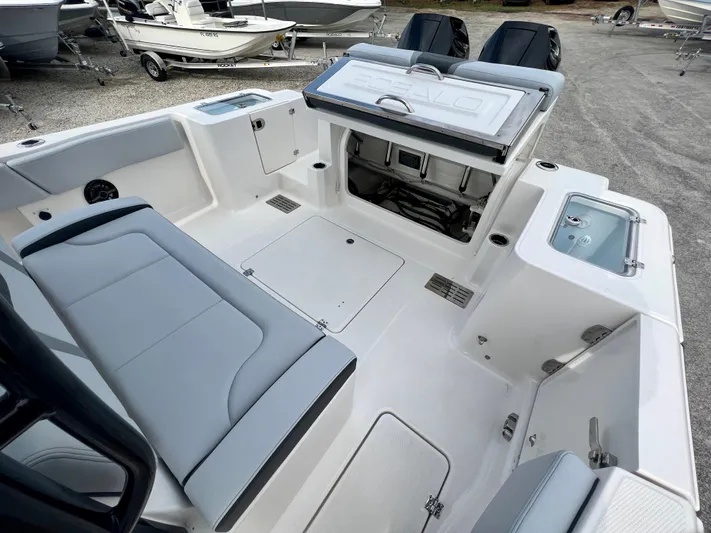  Yacht Photos Pics 2025 Robalo R300 boat interior with seating, storage, and modern design features.