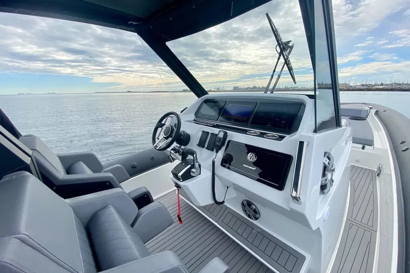  Yacht Photos Pics 2026 Northstar ION 12 boat interior with modern dashboard, steering wheel, and ocean view.