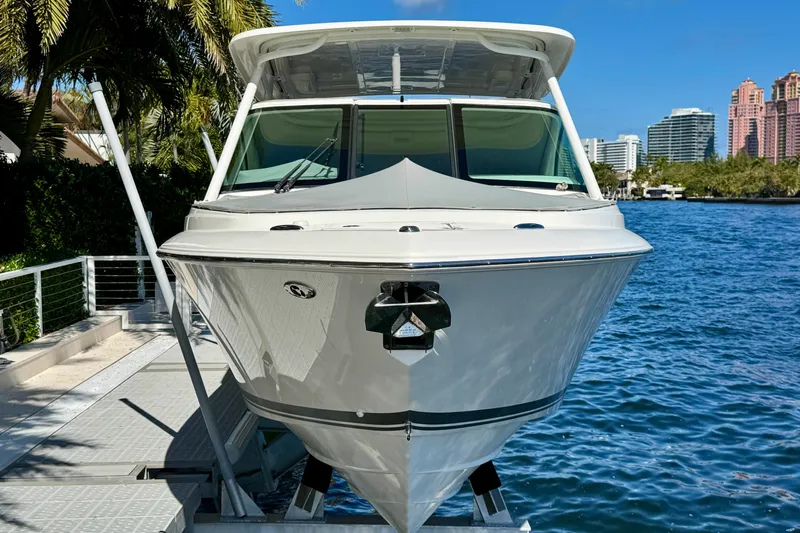  Yacht Photos Pics 2020 Pursuit DC 266 Dual Console boat docked by waterfront.