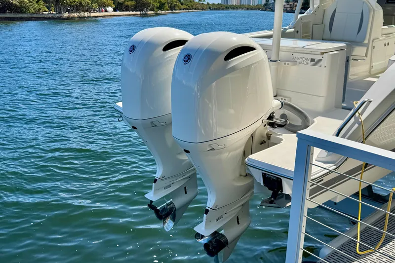  Yacht Photos Pics 2020 Pursuit DC 266 Dual Console with twin outboard motors on water.