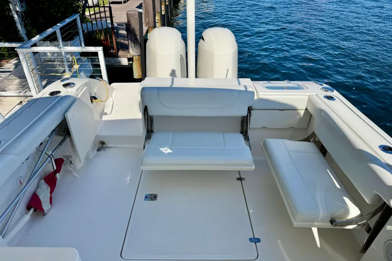 Yacht Photos Pics 2020 Pursuit DC 266 Dual Console boat interior with white seating and ocean view.