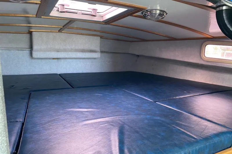 Apollo Axon Yacht Photos Pics Interior cabin of 2007 Armstrong Marine Catamaran with blue cushioned seating.