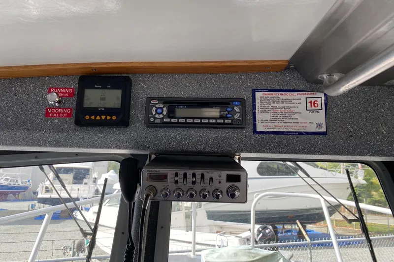 Apollo Axon Yacht Photos Pics Control panel inside a 2007 Armstrong Marine Catamaran, featuring navigation and communication equipment.