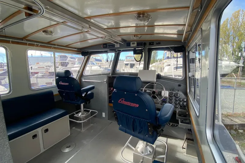 Apollo Axon Yacht Photos Pics Interior of a 2007 Armstrong Marine Catamaran, featuring helm and seating area.