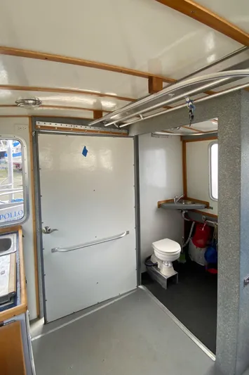 Apollo Axon Yacht Photos Pics 2007 Armstrong Marine Catamaran interior with toilet and storage area.