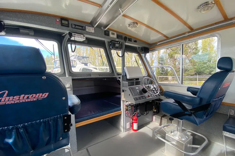 Apollo Axon Yacht Photos Pics Interior of a 2007 Armstrong Marine Catamaran, featuring navigation controls and seating.