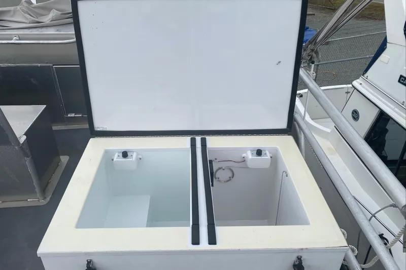 Apollo Axon Yacht Photos Pics Open storage compartment on a 2007 Armstrong Marine Catamaran deck.