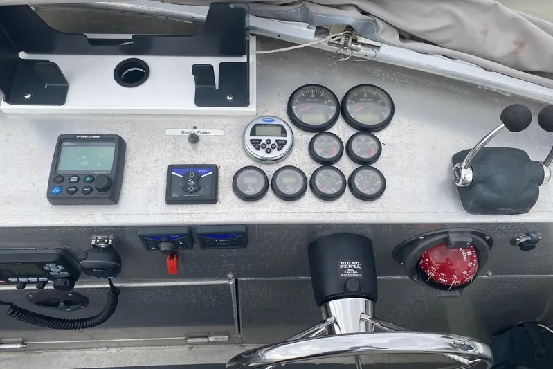 Apollo Axon Yacht Photos Pics Control panel of a 2007 Armstrong Marine Catamaran with gauges and navigation equipment.