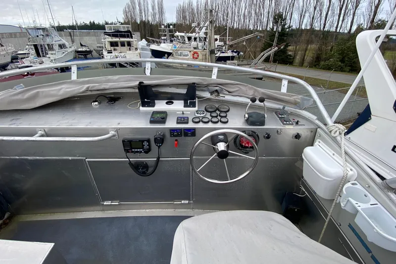 Apollo Axon Yacht Photos Pics 2007 Armstrong Marine Catamaran helm with steering wheel and control panel.