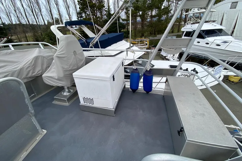 Apollo Axon Yacht Photos Pics 2007 Armstrong Marine Catamaran deck with storage and covered seating.