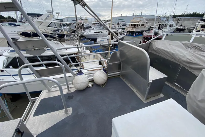 Apollo Axon Yacht Photos Pics 2007 Armstrong Marine Catamaran docked at marina, surrounded by various boats.