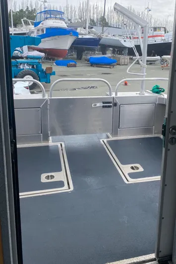 Apollo Axon Yacht Photos Pics 2007 Armstrong Marine Catamaran deck with boats in the background.